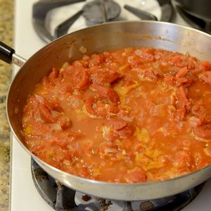 Tomatoes & onions in pan 500