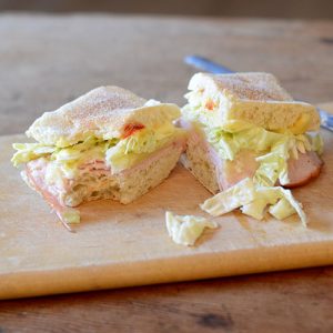 Turkey Slaw Sriracha Sandwich Split bite out 500