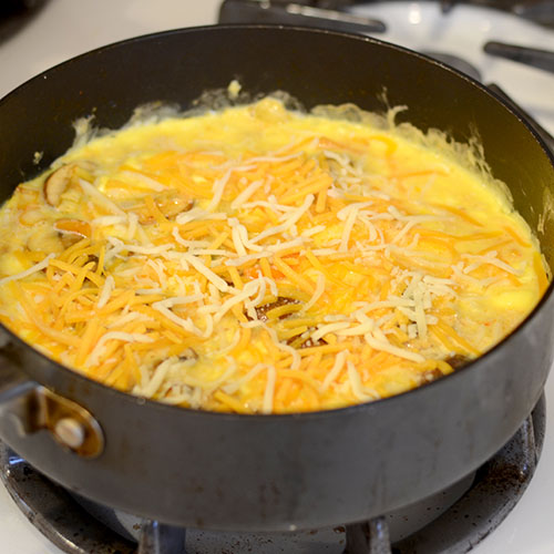 Cheese added in pan 500