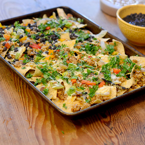 Everything-nachos nachos, Mexican, cheese, ground turkey, black beans, peppers & cilantro