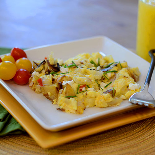 Goat-cheese-scrambled-eggs eggs, scrambled, onions, potatoes, jalapeno, cheese, goat cheese, salt, pepper