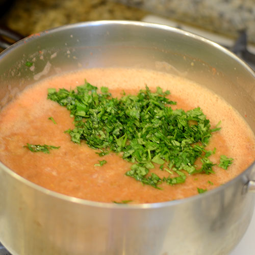 Parsley-added-to-soup parsley added to soup, herbs, vegetables