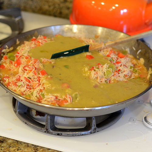 Sauce-added rice, mexican, peppers, onions, enchilada sauce, tomatoes, toasting