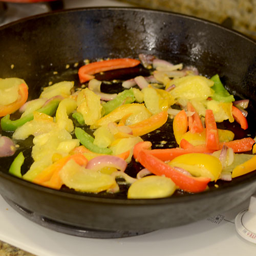 Vegetables-in-skillet skillet, peppers, tomatoes, red onions