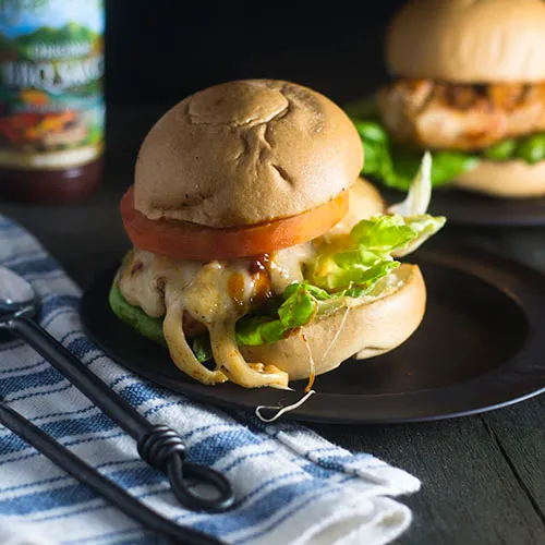 Change up your Memorial day dinner with this Grilled Chicken and Cheese sandwich. It is tangy and gooey and a mouthful.