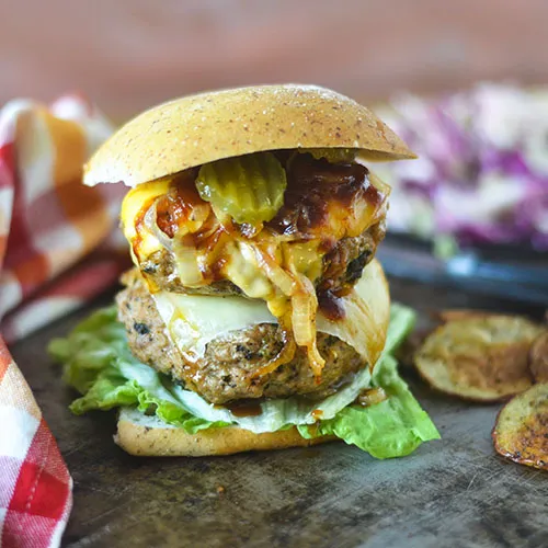 Grilled turkey onion burger is a loaded burger for your memorial day dinner. You won't be able to get your mouth around this one.