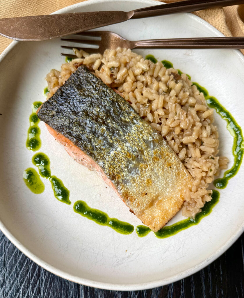 Crispy Skin Salmon Over Mushroom Risotto with Basil Oil