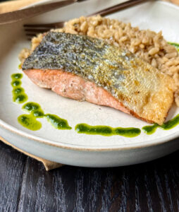Crispy Skin Salmon Over Mushroom Risotto with Basil Oil