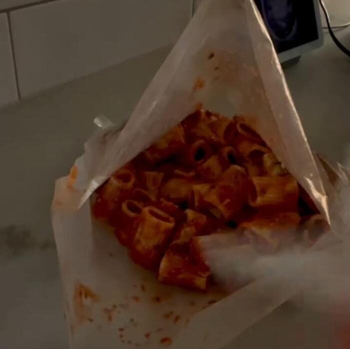 Cooked penne in a vacuum seal bag before sealing