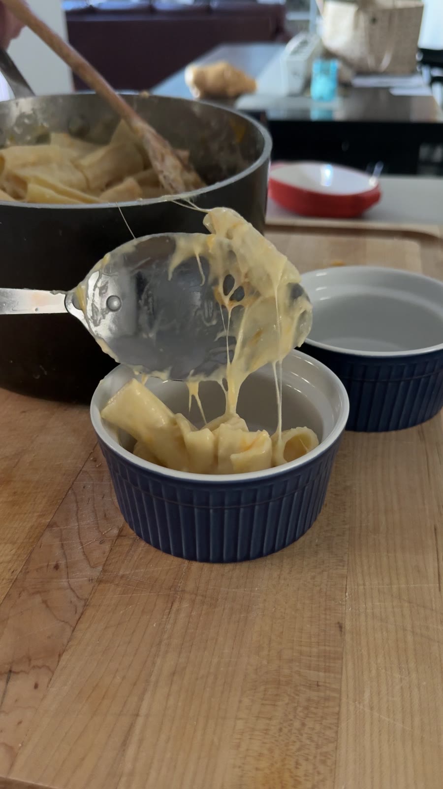 Cheesy mac and cheese spooned into a ramekin