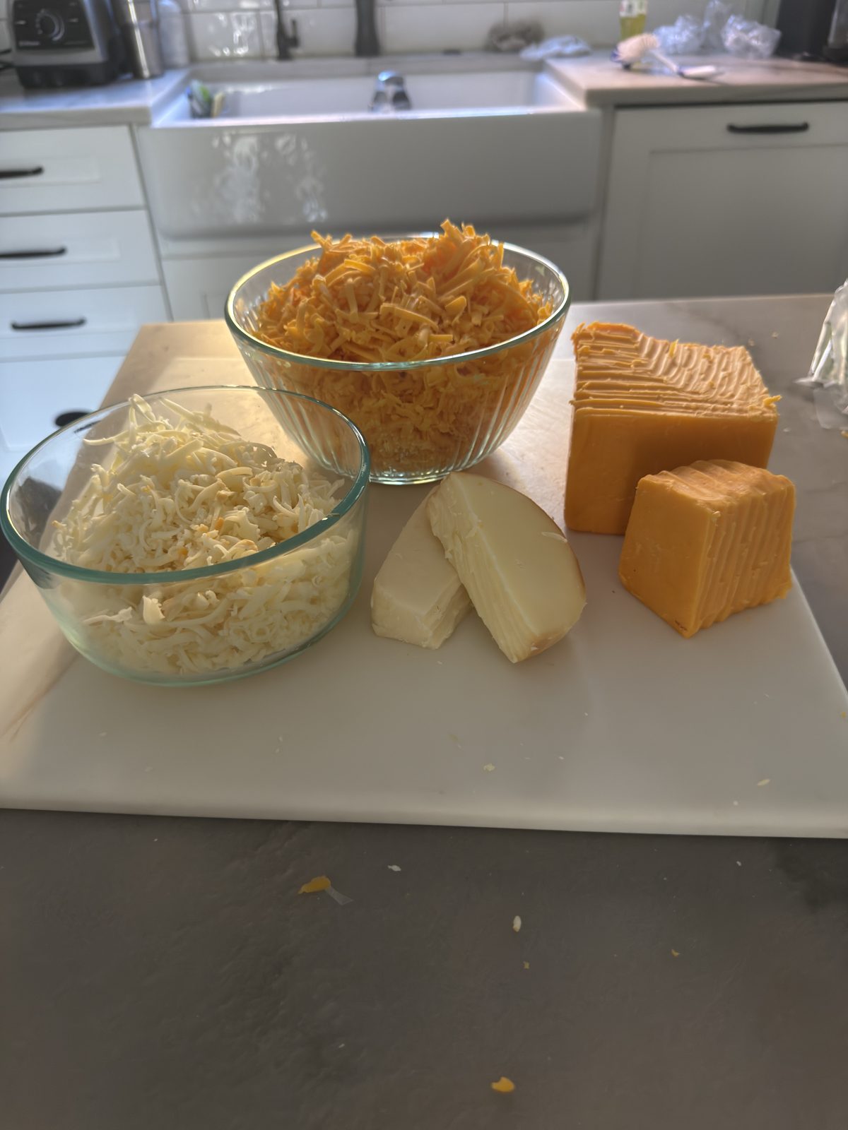 Shredded sharp cheddar, smoked Gouda and fontina for mac and cheese
